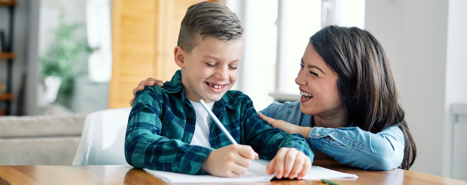 Parent helping son with homework